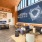 spacious lounge room with ample seating and modern colors and decor with bright-natural lighting