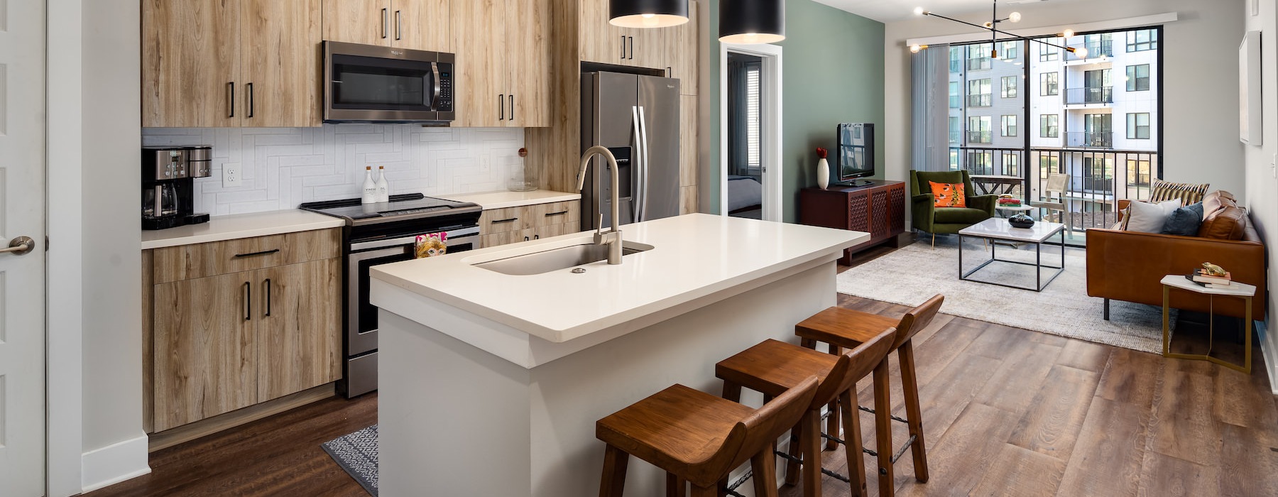 Kitchen with modern wood cabinets at Annett apartments in Atlanta, GA.