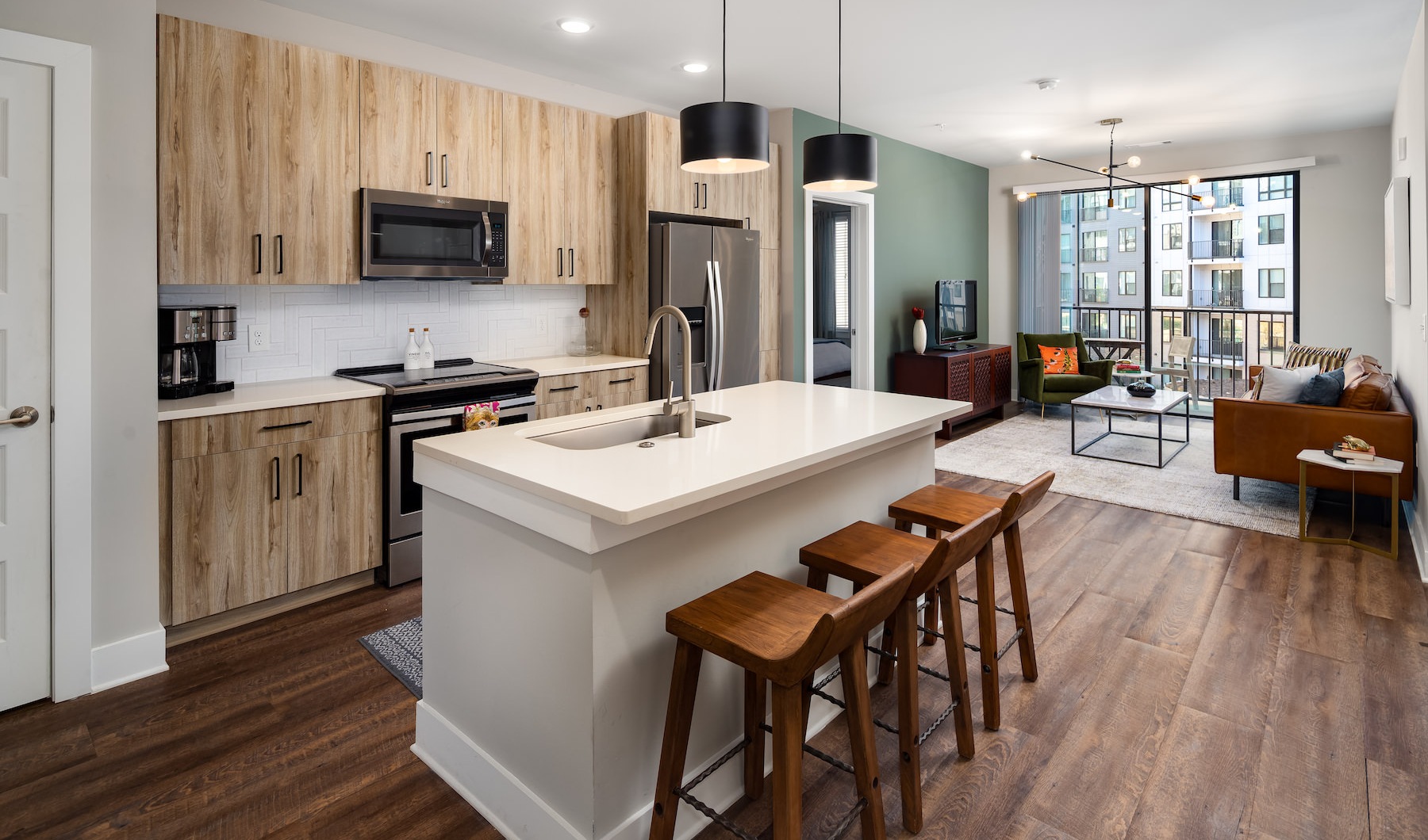 Kitchen with modern wood cabinets at Annett apartments in Atlanta, GA. Kitchen with modern wood cabinets at Annett apartments in Atlanta, GA.