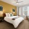 bedroom with a large window and modern decor