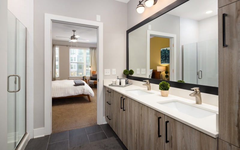 bathroom with a large mirror and ample lighting