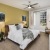 bedroom with a large window and modern decor