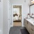 bathroom with a large mirror and ample lighting