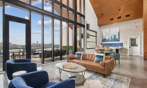large, bright clubhouse with floor-to-ceiling windows