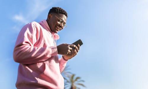 man looking at his cell phone